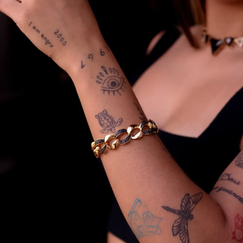 PULSEIRA GRUMET  NEGRA CRAVEJADO BANHADO A OURO 18K