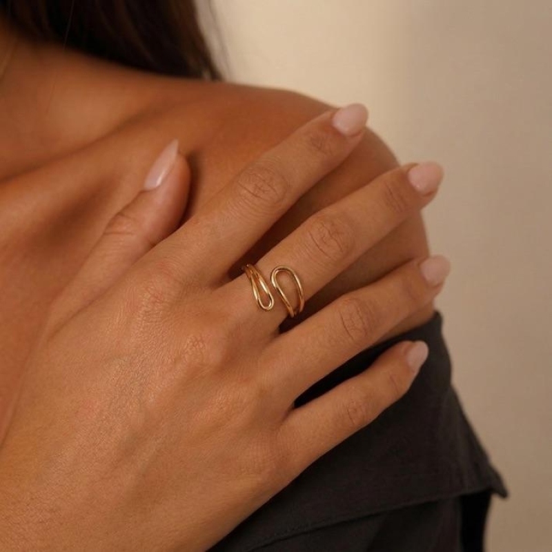 ANEL REGULAVEL FORMAS ORGANICA  - BANHADO A OURO 18K