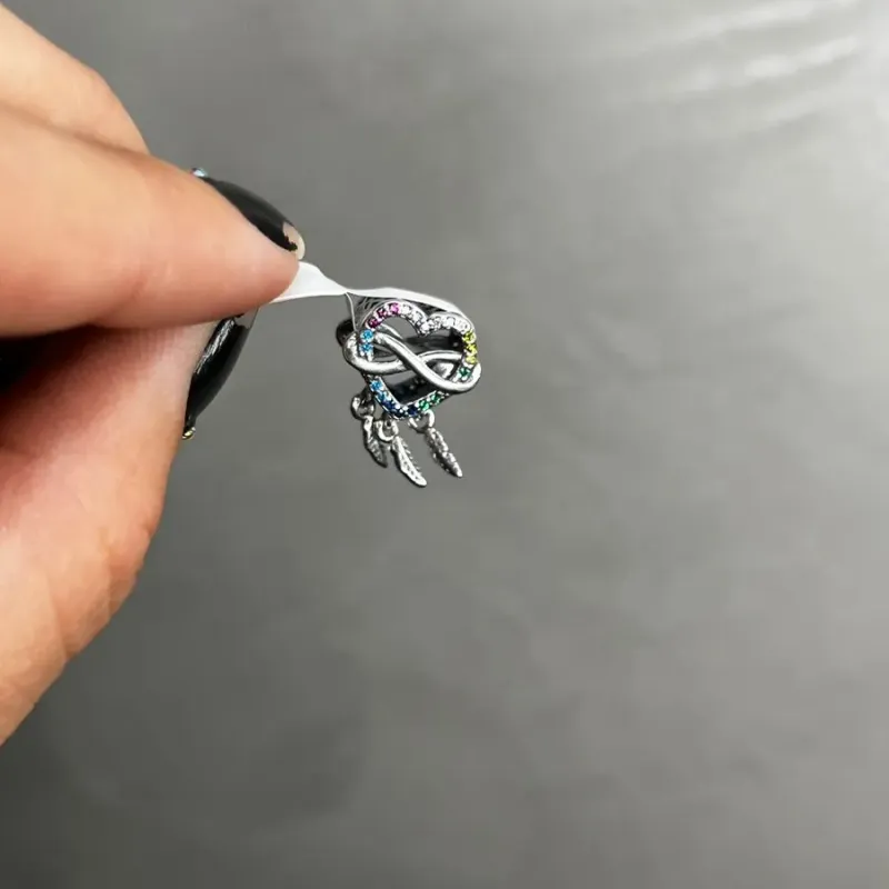 BERLOQUE PENDURADO CORAÇÃO COM PENA ZIRCONIA COLORS-PRATA 925 BERLOQUE PENDURADO CORAÇÃO COM PENA ZIRCONIA COLORS-PRATA 925