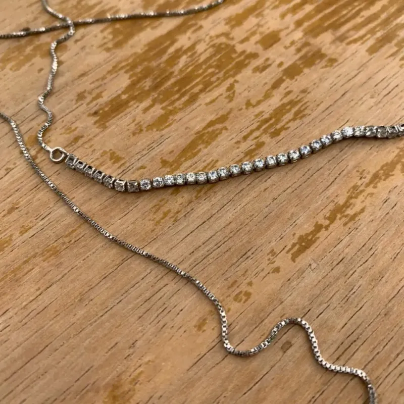 CORRENTE DUPLA REGULÁVEL ZIRCONIA CRISTAL, RIVIERA,GRAVATINHA - BANHADO A RÓDIO BRANCO CORRENTE DUPLA REGULÁVEL ZIRCONIA CRISTAL, RIVIERA,GRAVATINHA - BANHADO A RÓDIO BRANCO