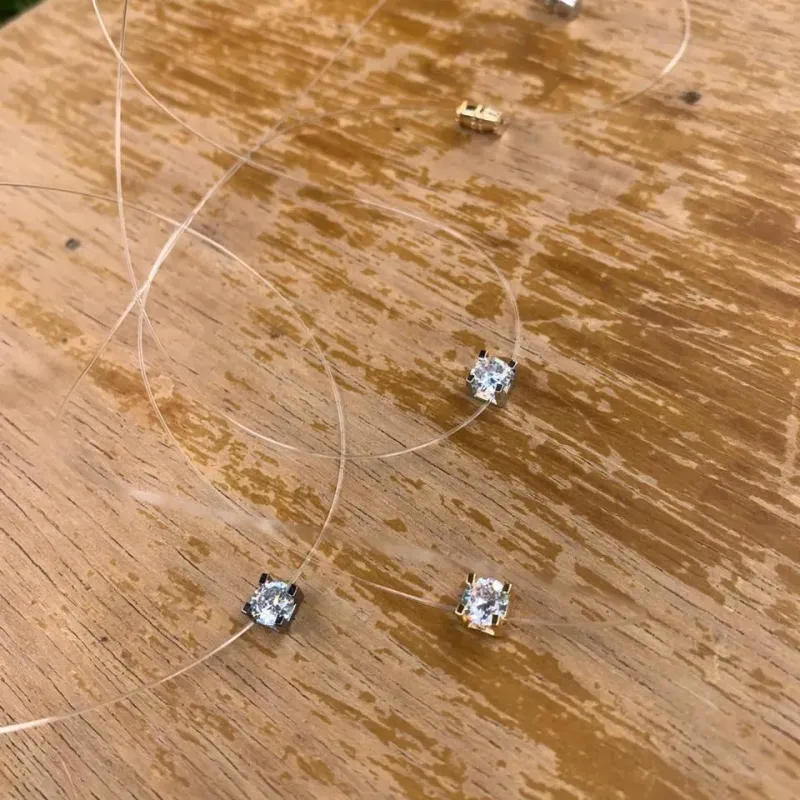 CORRENTE PINGO DE LUZ QUADRADO NO FIO DE NAILON - BANHADO A RÓDIO NEGRO CORRENTE PINGO DE LUZ QUADRADO NO FIO DE NAILON - BANHADO A RÓDIO NEGRO