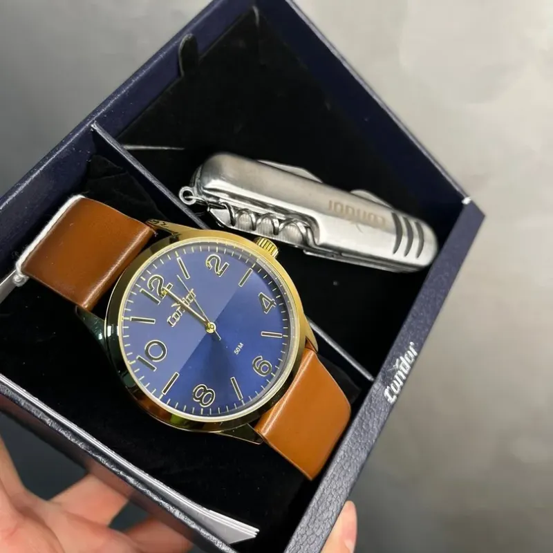 RELÓGIO CONDOR MASCULINO DOURADO COM INTERIOR AZUL METALICO PULSEIRA EM COURO MARROM - BRINDE CANIVETE MO2115BP4P- COR DOURADA RELÓGIO CONDOR MASCULINO DOURADO COM INTERIOR AZUL METALICO PULSEIRA EM COURO MARROM - BRINDE CANIVETE MO2115BP4P- COR DOURADA