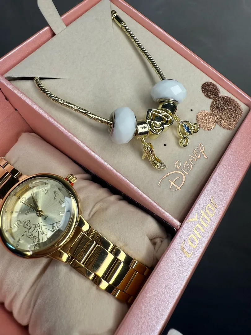 RELOGIO CONDOR FEMININO LINHA DISNEY DOURADO COM FUNDO CINDERELA ACOMPANHA ACESSORIOS PULSEIRA COM BERLOQUES PERSONALIZADO PERSONAGEM CO2035NMW/K4X - COR AÇO DOURADO