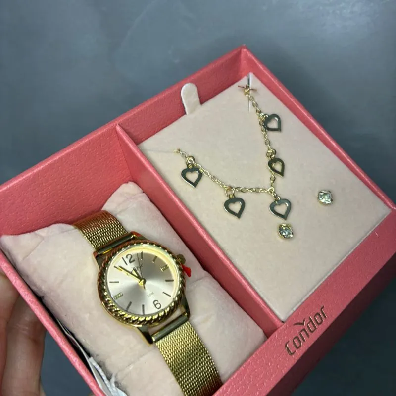 RELOGIO CONDOR FEMININO DOURADO PULSEIRA ESTREIRA COM FUNDO ROSÉ E LATERAL TRANÇADA ACOMPANHA ACESSORIO CORRENTE E BRINCO C02035NPE/K4J - COR AÇO DOURADO