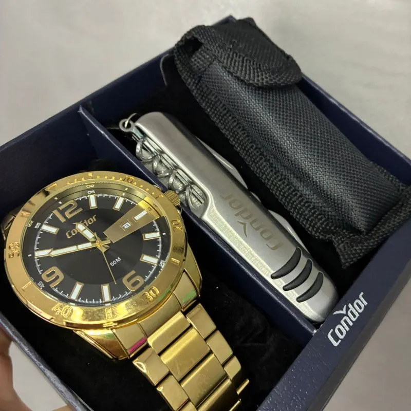 RELOGIO CONDOR MASCULINO DOURADO PULSEIRA BLOCO COM FUNDO PRETO E DOURADO E DATA COM ACESSORIO  C02115MWO/K4P- COR AÇO DOURADO