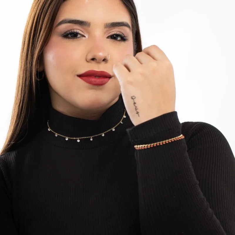 PULSEIRA COM SEQUENCIA DE ESTRELA COM APLICAÇÃO DE RESINA VERMELHA E EXTENSOR - BANHADO A OURO 18K