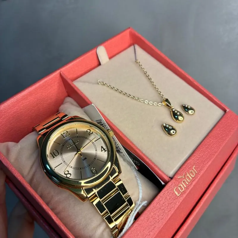 RELOGIO CONDOR FEMININO PULSEIRA GOMO LATERAL LISA E FUNDO METÁLICO ROSÉ - ACOMPANHA CONJUNTO DE BRINCO E CORRENTE  CO2035NRD/K4J- COR AÇO DOURADO