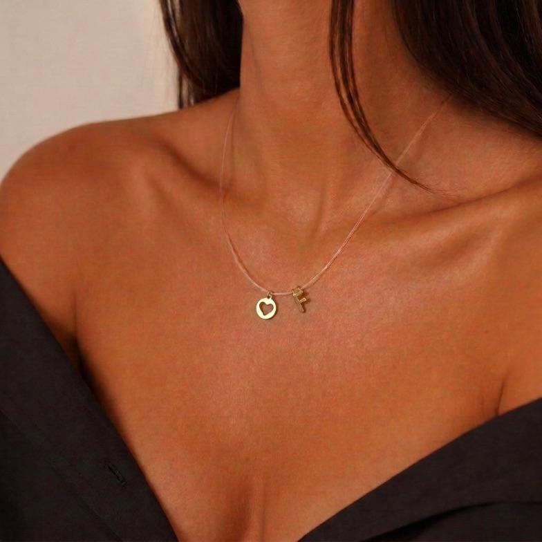 CORRENTE FIO DE SILICONE COM PINGENTE INCIAL F MICRO E CORAÇÃO VAZADO - BANHADO A OURO 18K