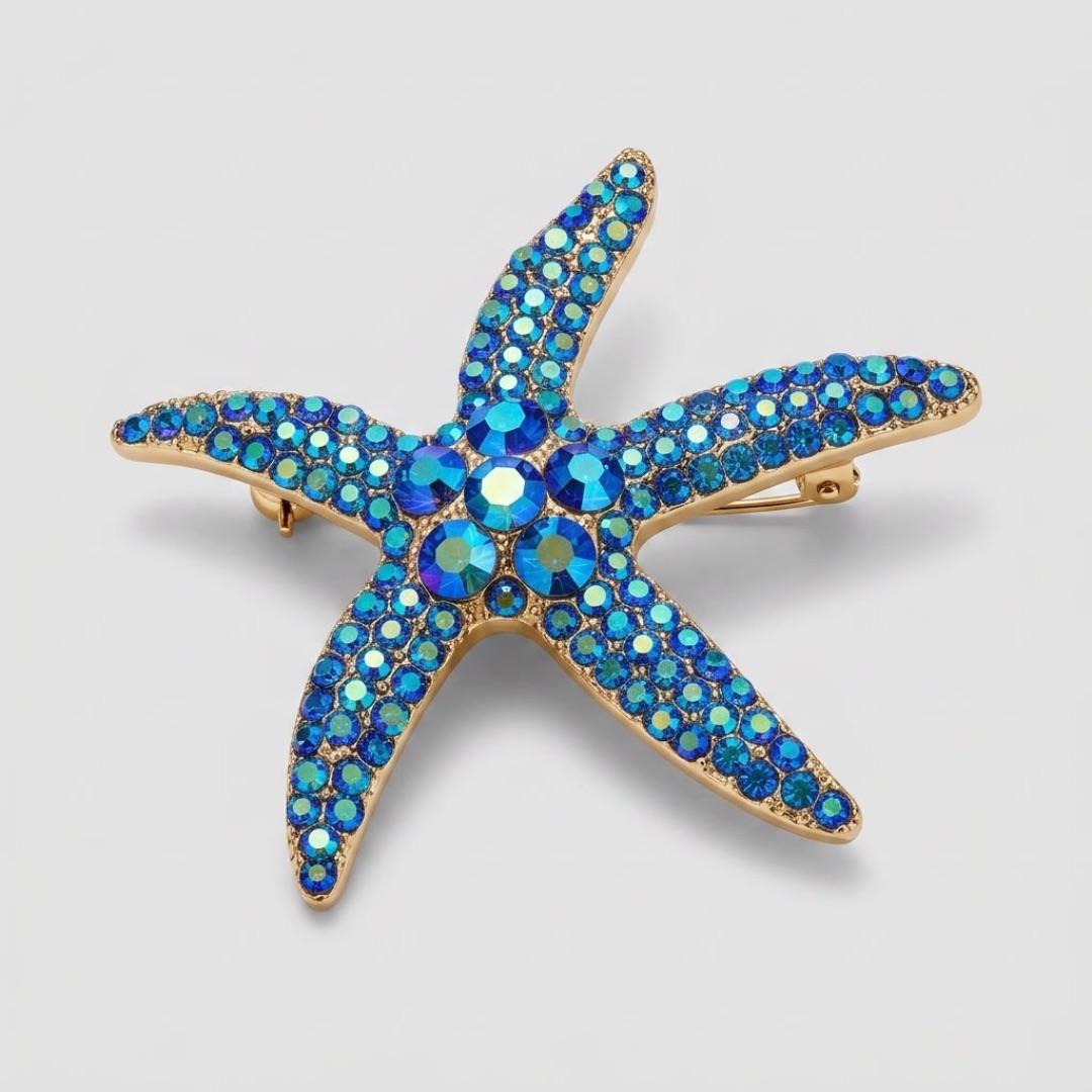 BROCHE FASHION ESTRELA DO MAR COM ZIRCÔNIA AZUL - COR OURO