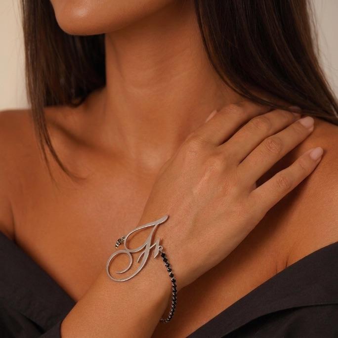 PULSEIRA RIVIERA ZIRCONIA NEGRA COM INCIAL F- BANHADO A RODIO BRANCO